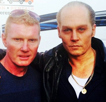 Red Shea standing with Johnny Depp.
